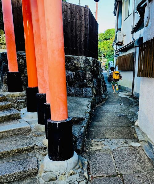 Boy running off to school - Kyoto, Japan